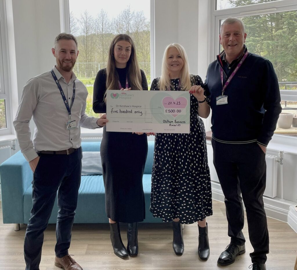 Dr Kershaws charity being presented with a donation amount