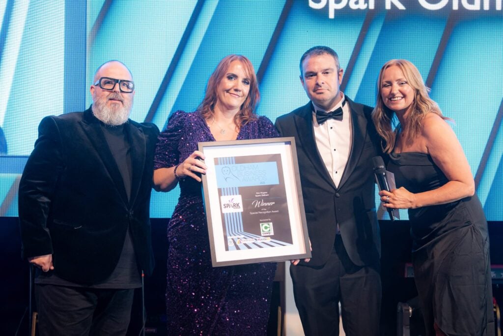 Kim Rogers collecting the 2025 Special Recognition award