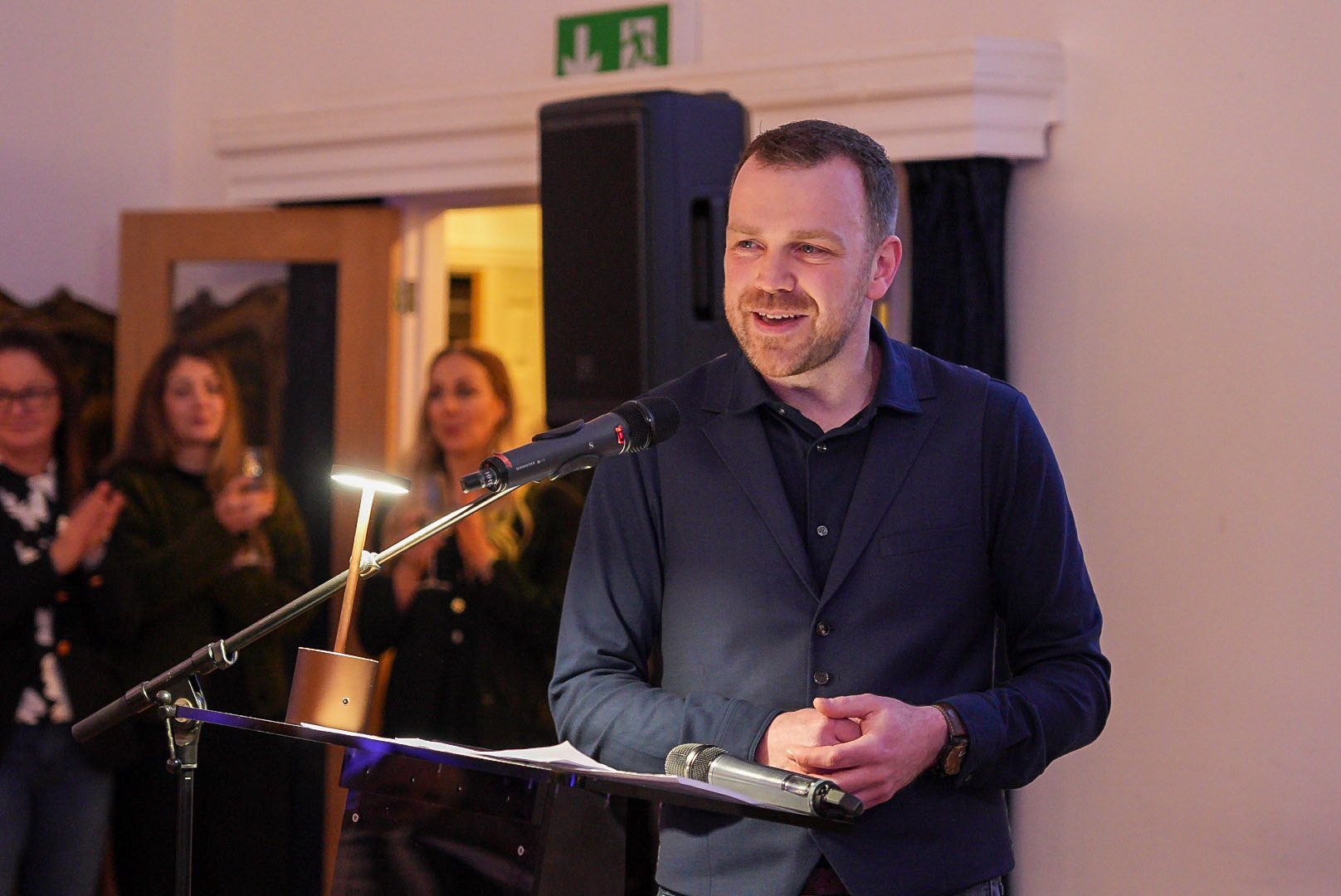 Man speaking at an event.